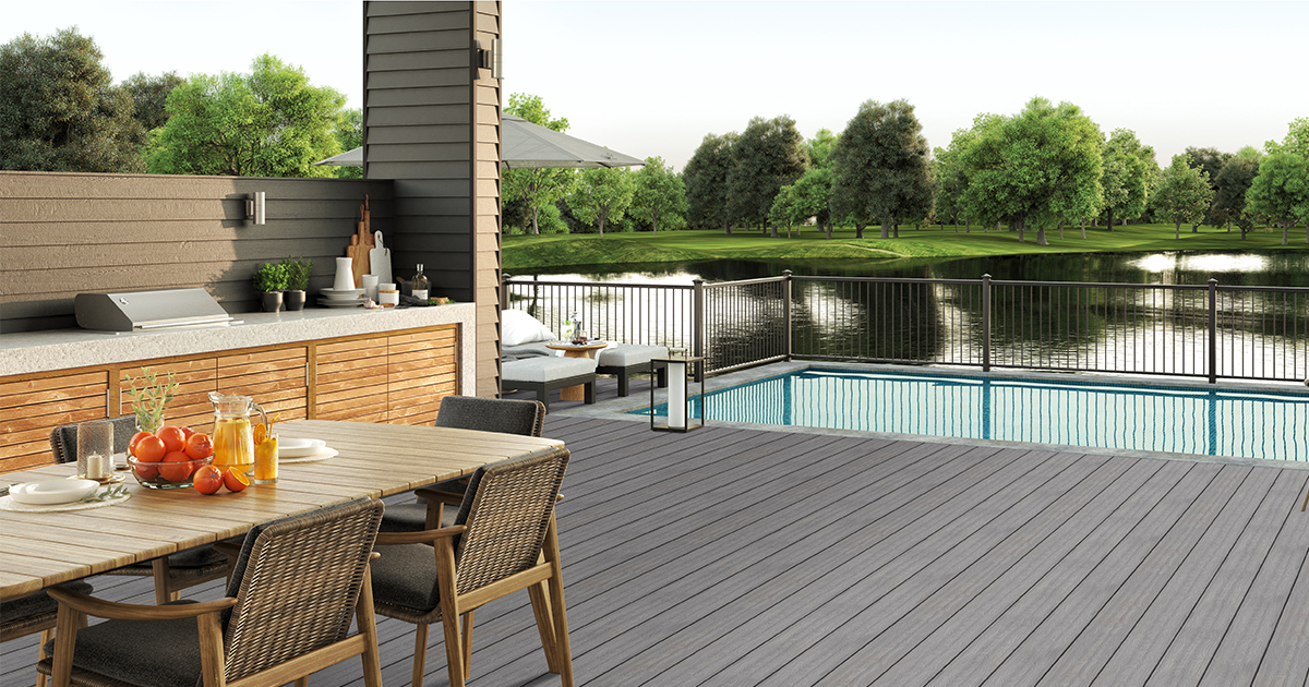 An outdoor living space with Fairway textured bronze steel deck railing.