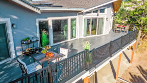 Outdoor living space with composite decking and deck railing.