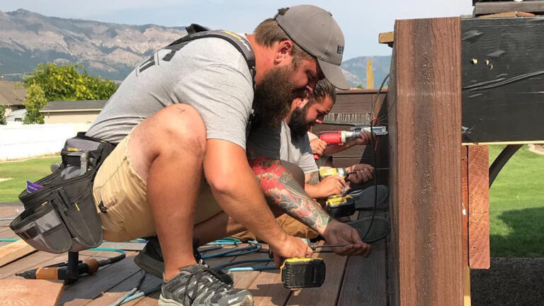 Deck builders building a composite deck.