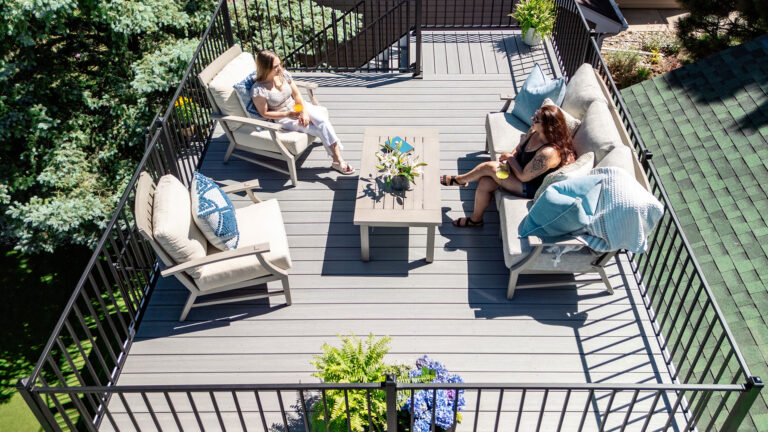 Outdoor living space with composite decking and deck railing.