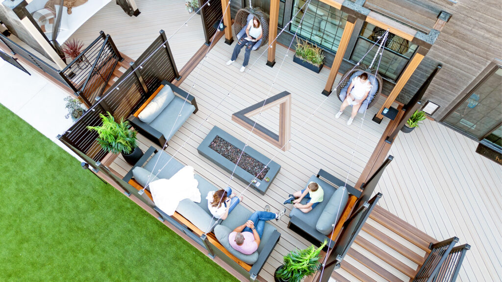 Outdoor living space featuring composite decking and metal railing.