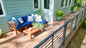Outdoor living space with composite decking and aluminum deck railing.